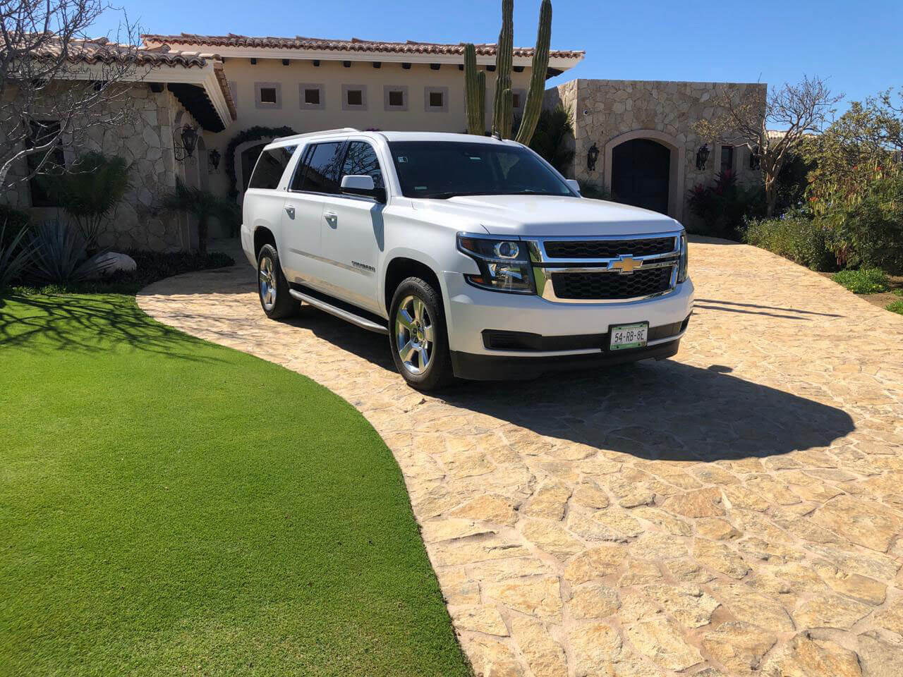 White Luxury SUV leaving private residence | Cabo Airport Transportation